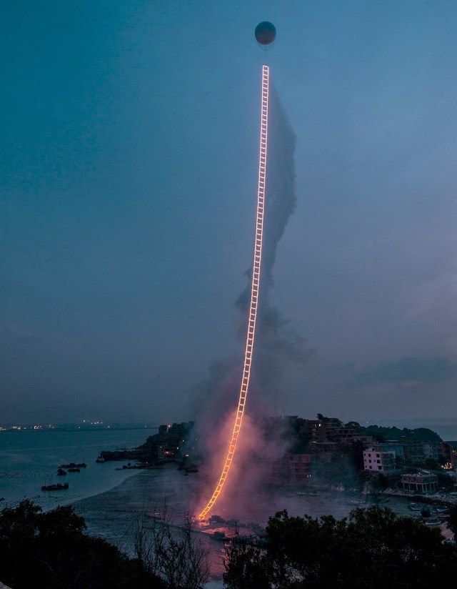 Glowing ladder installation at dusk